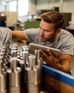 Workers checking product completion Workers checking product completion